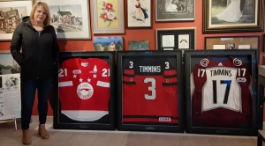  Kay Conor Timmins mom, with his Hockey jerseys.